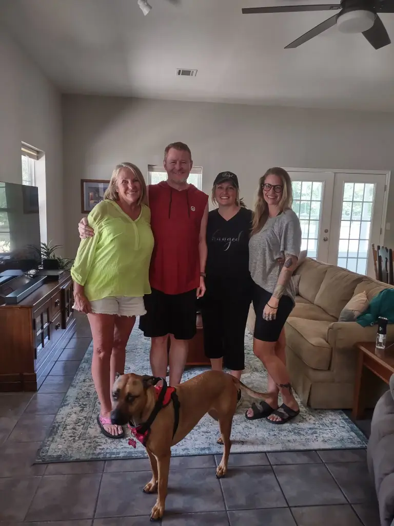 Barbie posing with her kids for a family photo at her home